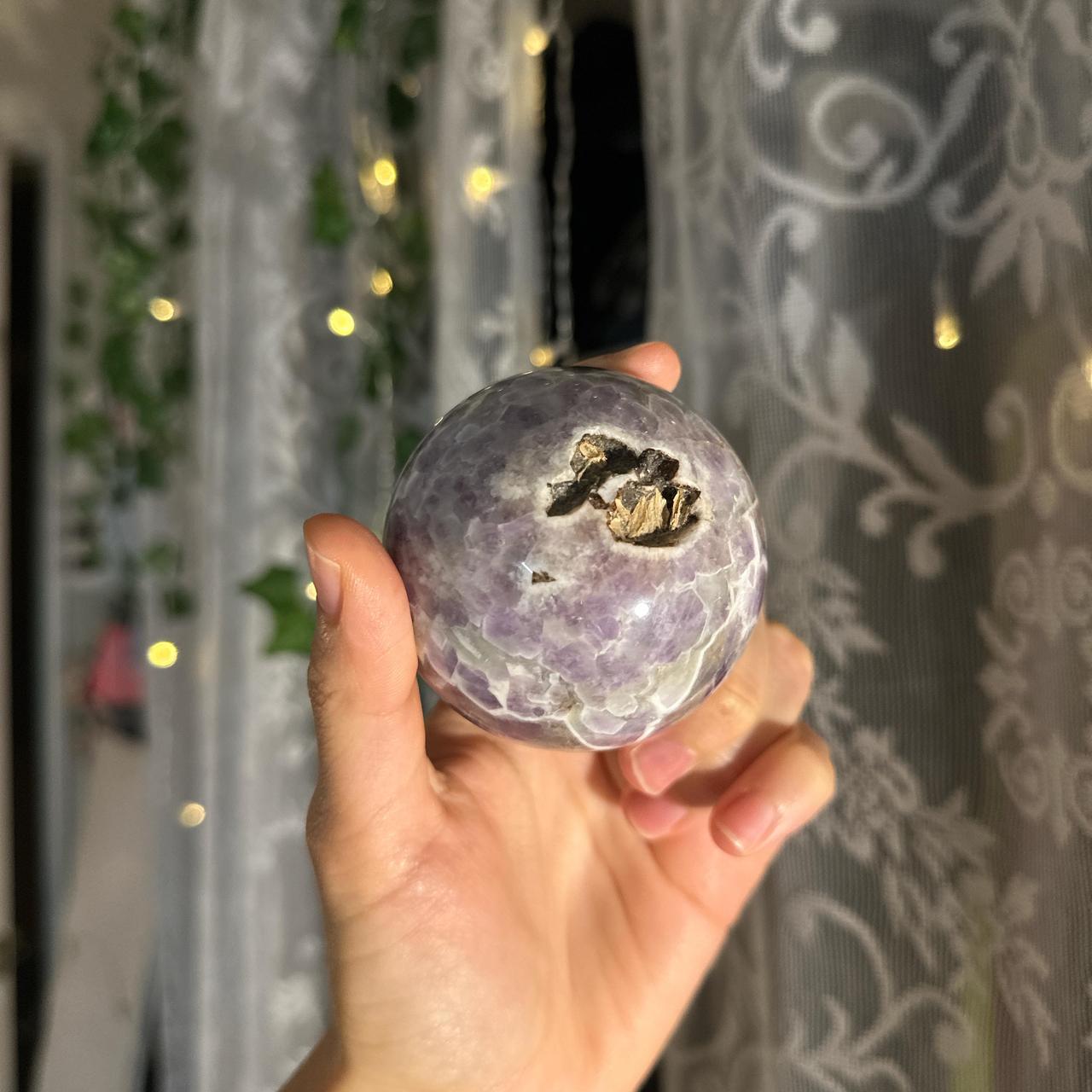 Purple amethyst sphere with some inclusion